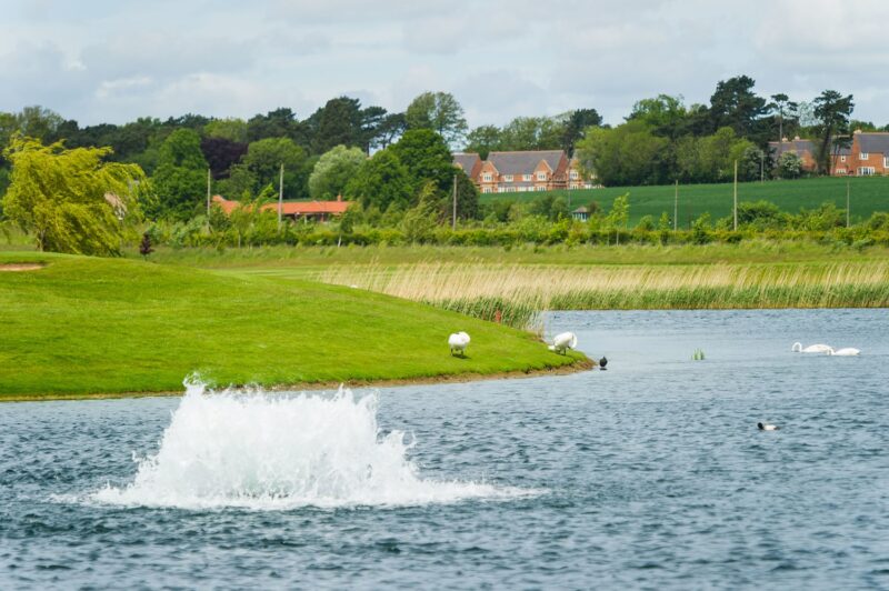 An Otterbine aerator working in the middle of a large body of water.