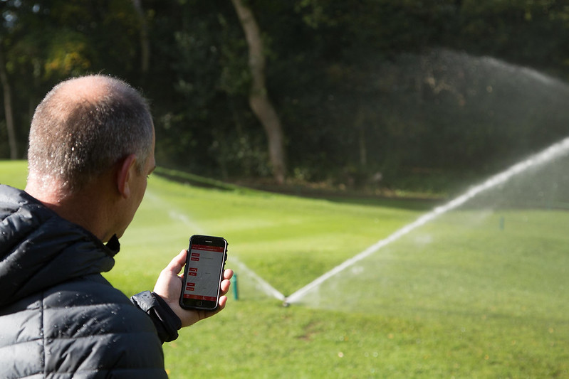 A Leighton Buzzard Golf Club greenkeeper controls his Toro Irrigation sprinkler via his mobile phone.