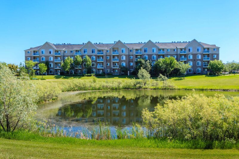 A shot of Trounce Pond sitting in front of the Lakewood Suburban Centre neighbourhood in Saksatoon.