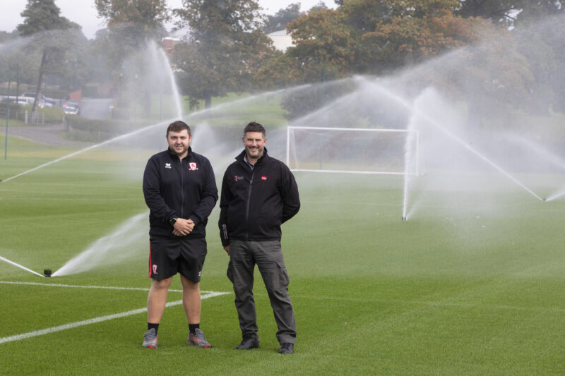 Pete Newton and Middlesbrough FC's Jack Cunningham in front of Middlesbrough FC's new irrigation system.